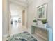 Inviting foyer with tiled floors, elegant decor, and arched doorways leading to the living area at 12826 Sorrento Way, Bradenton, FL 34211