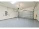 Clean and spacious garage with sealed floors and an automatic door at 12826 Sorrento Way, Bradenton, FL 34211