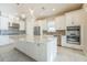 Gourmet kitchen featuring a large island, stainless steel appliances, and custom cabinetry at 12826 Sorrento Way, Bradenton, FL 34211