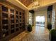 Modern lobby featuring a wine rack, elegant lighting, and contemporary decor at 12826 Sorrento Way, Bradenton, FL 34211