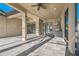Spacious covered patio with tile flooring, recessed lighting, and outdoor kitchen area for entertaining at 12826 Sorrento Way, Bradenton, FL 34211