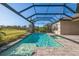 Sparkling pool with a screened enclosure, spa, and lush landscaping at 12826 Sorrento Way, Bradenton, FL 34211