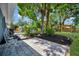 Charming backyard with patio area, mature trees and garden space at 3902 11Th W Ave, Bradenton, FL 34205