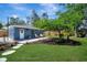 Quaint backyard space with comfortable seating and lush lawn at 3902 11Th W Ave, Bradenton, FL 34205