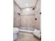 Modern bathroom shower features neutral tile, black fixtures, and built-in niche at 3902 11Th W Ave, Bradenton, FL 34205