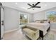 Bedroom with a slider to the backyard and an upholstered bench at 3902 11Th W Ave, Bradenton, FL 34205