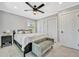 Bedroom with a bench, ceiling fan, and wood-look tile floors at 3902 11Th W Ave, Bradenton, FL 34205