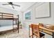 Cozy bedroom with a bunk bed and a functional desk space, perfect for children or guests at 3902 11Th W Ave, Bradenton, FL 34205