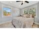 Bedroom with natural light, ceiling fan, and wood-look tile floors at 3902 11Th W Ave, Bradenton, FL 34205