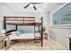 Comfortable bedroom featuring a bunk bed and ample natural light from a bright window at 3902 11Th W Ave, Bradenton, FL 34205
