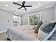 Bedroom featuring a sliding barn door to bathroom at 3902 11Th W Ave, Bradenton, FL 34205