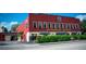Motorworks Brewing features a red brick exterior with visible signage and shaded outdoor seating at 3902 11Th W Ave, Bradenton, FL 34205