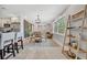 Charming dining area with a modern chandelier and seamless flow to the kitchen at 3902 11Th W Ave, Bradenton, FL 34205