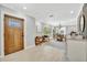 The front door opens into a light and bright living space with neutral colors, modern fixtures and a dining area at 3902 11Th W Ave, Bradenton, FL 34205