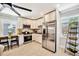 Bright kitchen showcasing white cabinets, stainless steel appliances, and ample counter space, a modern and functional design at 3902 11Th W Ave, Bradenton, FL 34205