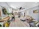 Open-concept living room features eat in kitchen with stainless steel appliances at 3902 11Th W Ave, Bradenton, FL 34205