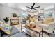 Open-concept living space with a modern kitchen and comfortable seating, perfect for entertaining at 3902 11Th W Ave, Bradenton, FL 34205
