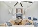 Cozy living room features a decorative fireplace, modern furniture, and a stylish rug, creating an inviting atmosphere at 3902 11Th W Ave, Bradenton, FL 34205