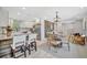 An open concept living space is highlighted by the eat-in bar and dining table and kitchen at 3902 11Th W Ave, Bradenton, FL 34205