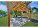 Backyard features a pergola with seating area and a well-maintained lawn at 3902 11Th W Ave, Bradenton, FL 34205
