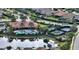 Enjoy this community clubhouse featuring a pool, tennis courts, and other amenities, set against a tranquil lake backdrop at 4020 Cascina Way, Sarasota, FL 34238