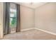 Bedroom with neutral carpet, baseboards, and a window at 4020 Cascina Way, Sarasota, FL 34238