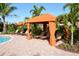 Relax in style with a comfortable cabana and lounge chairs by the pool, perfect for outdoor enjoyment at 4020 Cascina Way, Sarasota, FL 34238