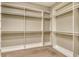 Walk-in closet with built-in shelving, providing ample storage space at 4020 Cascina Way, Sarasota, FL 34238