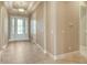 Elegant foyer with decorative ceiling, neutral walls, and tiled floors leading into the home at 4020 Cascina Way, Sarasota, FL 34238
