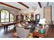 Spacious lounge featuring comfortable seating, dark wood accents, and community amenities at 4020 Cascina Way, Sarasota, FL 34238