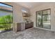 Outdoor kitchen area with granite countertops and stainless steel grill at 4020 Cascina Way, Sarasota, FL 34238