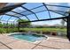 Relaxing screened-in pool with scenic water views at 4020 Cascina Way, Sarasota, FL 34238