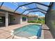 Screened-in pool with outdoor patio area and landscaping at 4020 Cascina Way, Sarasota, FL 34238