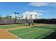 Well-maintained tennis court with lighting and professional surfacing, perfect for sports and recreation at 4020 Cascina Way, Sarasota, FL 34238