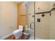 Modern bathroom showcasing a glass-enclosed shower with tiled walls and stylish fixtures at 7716 Club Ln, Sarasota, FL 34238