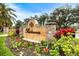 Prestancia community sign surrounded by colorful flowers and greenery, creating an inviting entrance at 7716 Club Ln, Sarasota, FL 34238