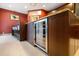 Kitchen island features wine cooler, barstool seating, and ample counter space for food preparation and entertaining at 7716 Club Ln, Sarasota, FL 34238