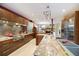 Spacious kitchen with stainless steel appliances, modern cabinetry, granite countertops and a functional island at 7716 Club Ln, Sarasota, FL 34238