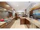 Bright, open kitchen features stainless appliances, granite countertops, and an expansive island with seating at 7716 Club Ln, Sarasota, FL 34238