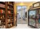 Bright office with built-in shelving and sliding door to the patio at 7716 Club Ln, Sarasota, FL 34238
