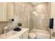 Elegant bathroom with marble tile, glass shower door, and modern fixtures at 1774 10Th St, Sarasota, FL 34236