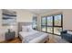 Bright bedroom featuring a large window, hardwood floors, and contemporary decor at 1774 10Th St, Sarasota, FL 34236