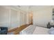 Bedroom with hardwood floors and white closets at 1774 10Th St, Sarasota, FL 34236