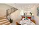Bright dining area leading to a modern kitchen and staircase at 1774 10Th St, Sarasota, FL 34236