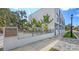 Modern townhomes with sleek design, lush landscaping, and street view at 1774 10Th St, Sarasota, FL 34236
