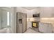 Modern kitchen featuring stainless steel appliances, white cabinets, and granite countertops at 1774 10Th St, Sarasota, FL 34236