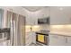 Modern kitchen with white cabinets, granite countertops, and stainless steel appliances at 1774 10Th St, Sarasota, FL 34236