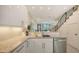 Modern kitchen with granite counters, white cabinets, stainless appliances, and an open floor plan at 1774 10Th St, Sarasota, FL 34236