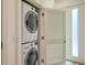 Modern stacked washer and dryer in a dedicated laundry space at 1774 10Th St, Sarasota, FL 34236