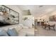 Open-concept space with the living room, kitchen and dining areas, plus modern staircase at 1774 10Th St, Sarasota, FL 34236
